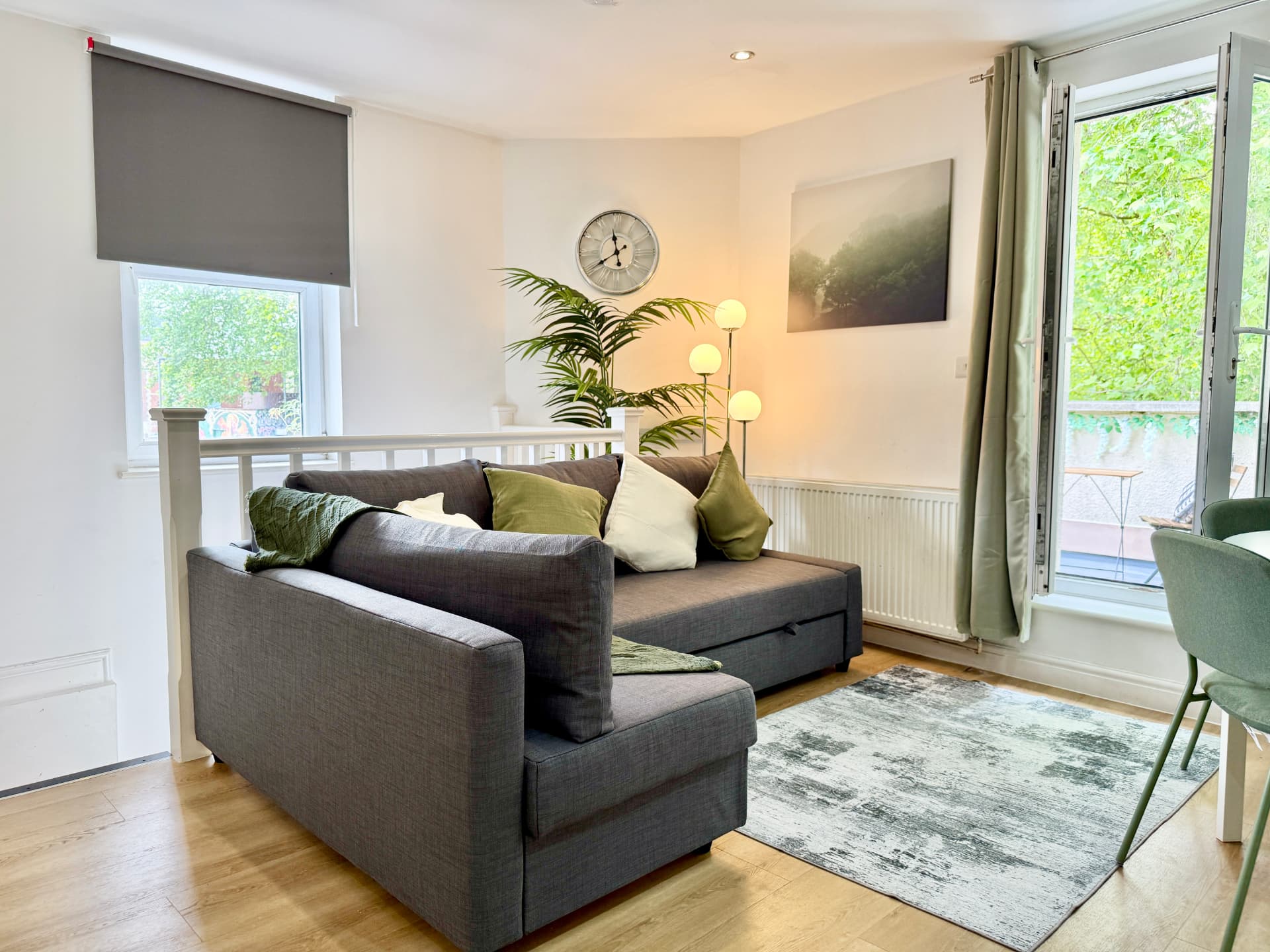 Bright living room at 56B Mina Road with sofa and garden doors