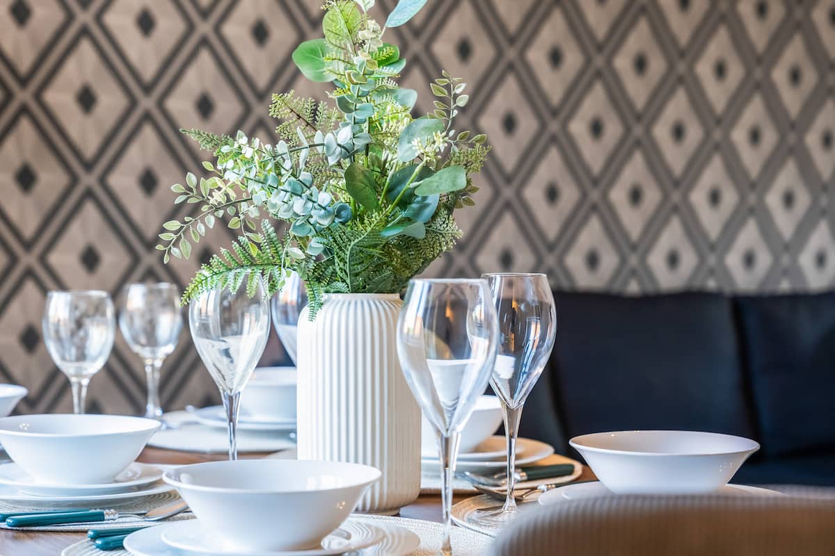 Dining table set for guests in Coventry house