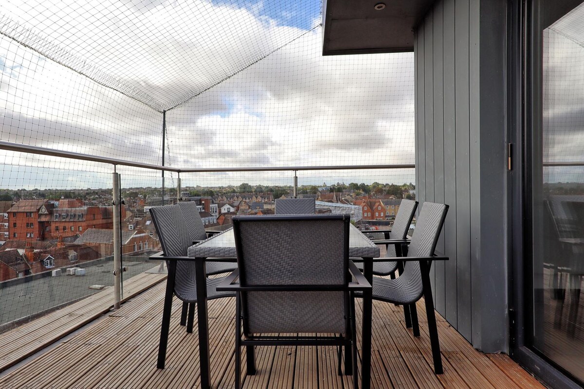 Private rooftop terrace with dining table and rooftop views over Chelmsford